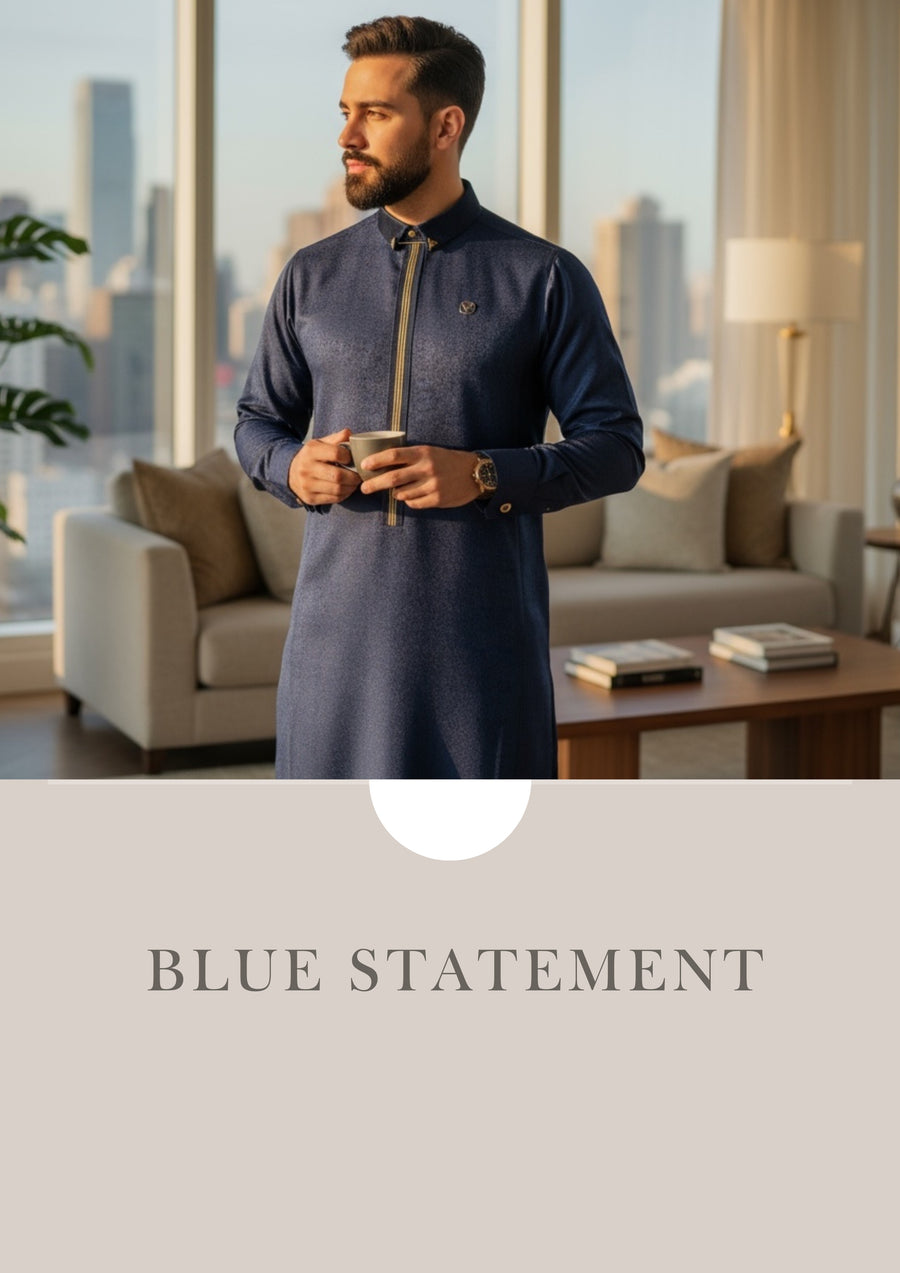Boy wearing a black Al Ameer KDR2670 Arabian thobe with a stand collar and refined detailing.