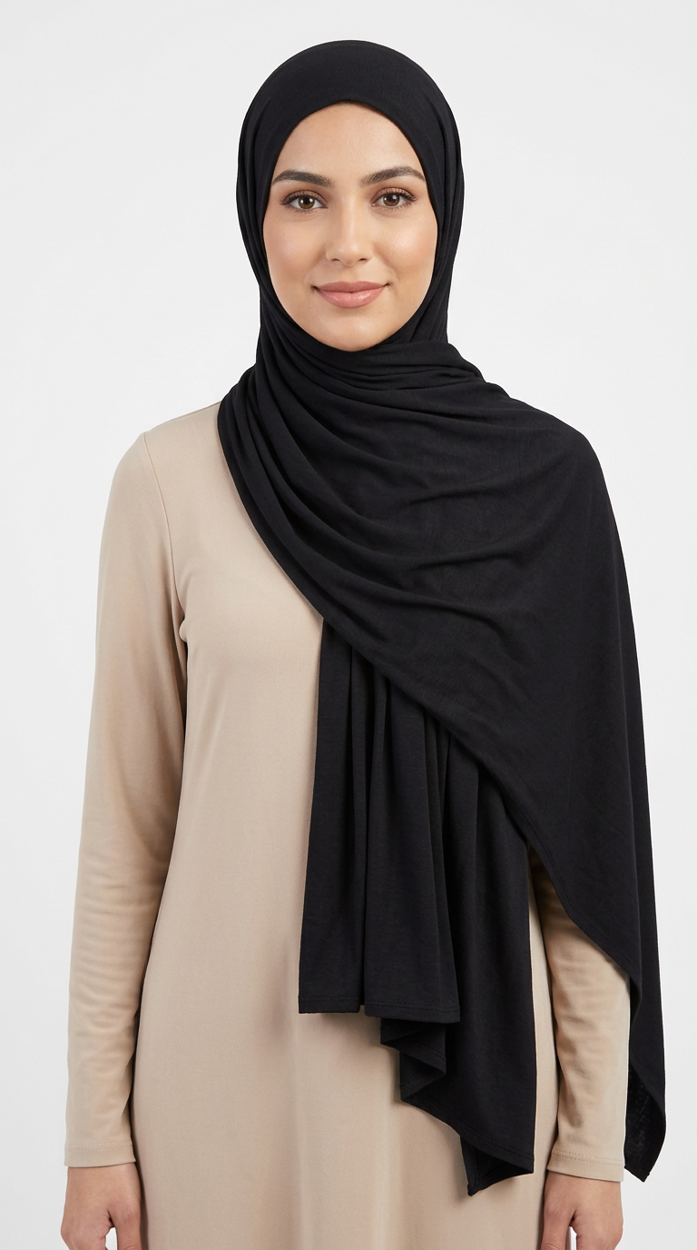 Woman wearing the Black Big Jersey Hijab with a beige top