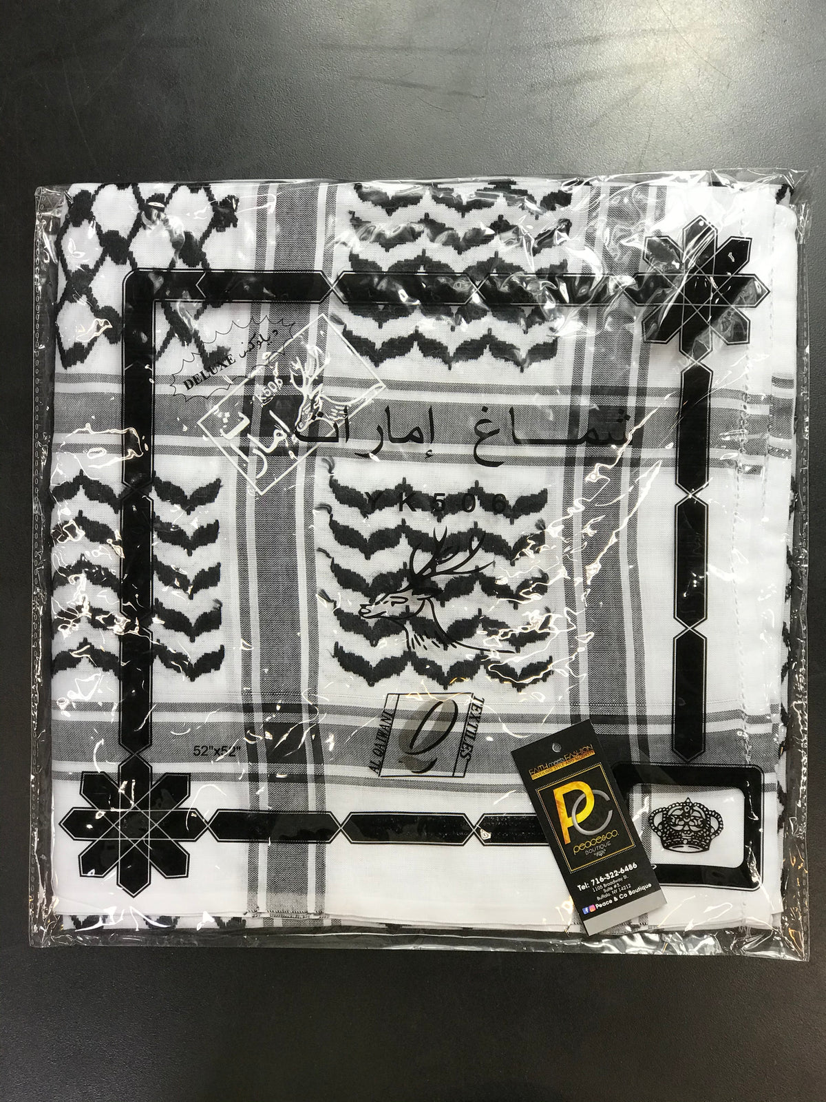 Black and white Palestinian-style keffiyeh scarf displayed as a square scarf.