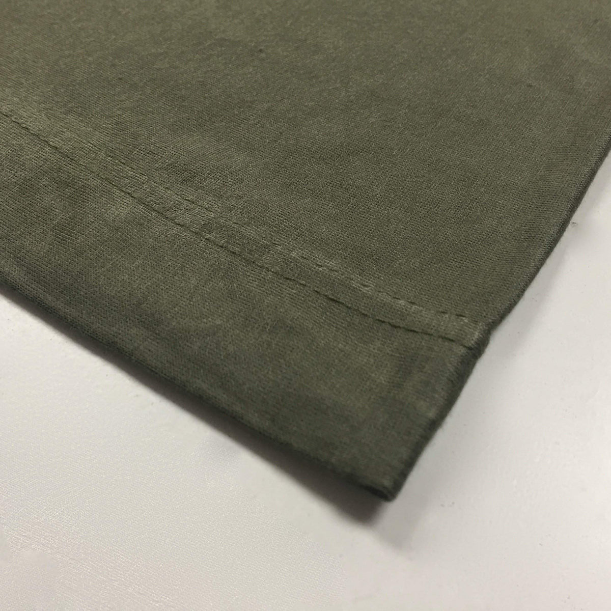 A close-up of an olive green hijab cap with a visible strap. Hijab Cap - Olive hijab product image
