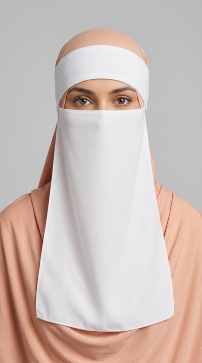 White Hard Band Niqab 01 worn with a peach hijab, front view