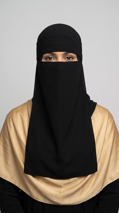 Black Gold Side Niqab 08 with a beige hijab, front view