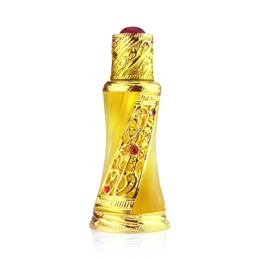 A golden tinted perfume bottle with intricate designs and red stones.