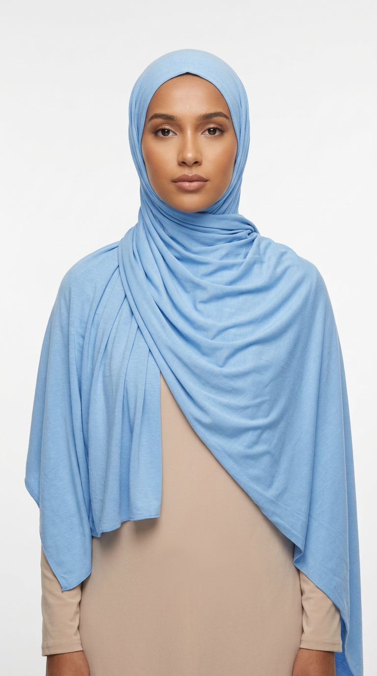 Woman wearing the Sky Blue Big Jersey Hijab with a beige top