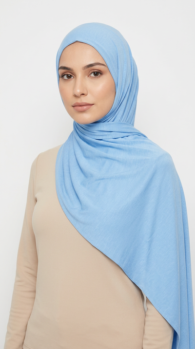 Woman wearing the Sky Blue Big Jersey Hijab with a beige top