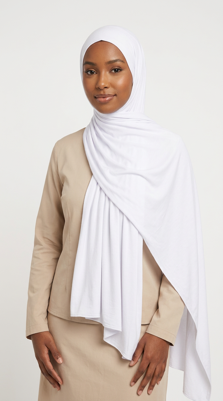 Woman wearing the White Big Jersey Hijab with a beige top