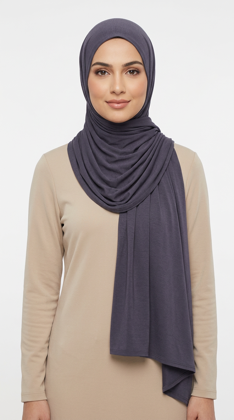 Woman wearing the Iron Big Jersey Hijab with a beige top