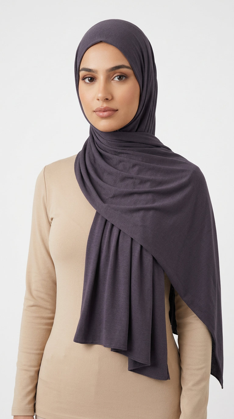 Woman wearing the Iron Big Jersey Hijab with a beige top