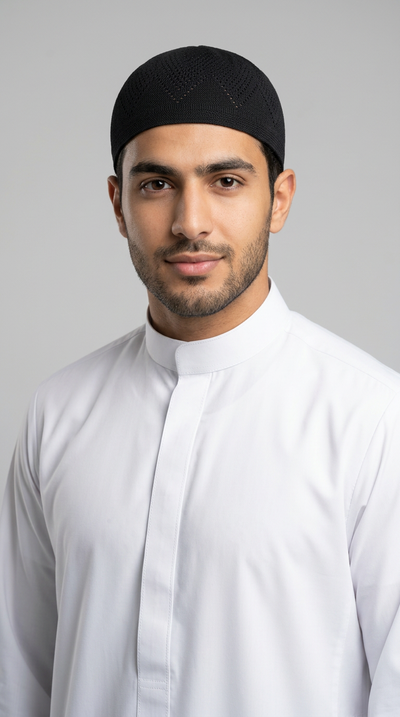 Man wearing a black topi prayer cap, front view