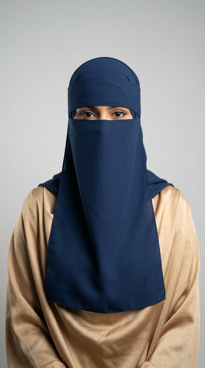 Model wearing a navy Gold Side Niqab 08