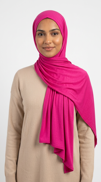 Woman wearing the Magenta Big Jersey Hijab with a beige top