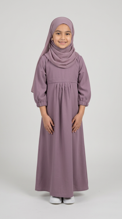 Girl wearing a teal front-pocket abaya with matching hijab.