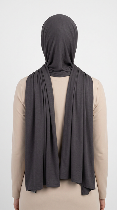 Model wearing a charcoal gray Premium Jersey Hijab, back view