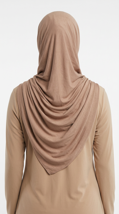 Model wearing a camel brown Premium Jersey Hijab, back view