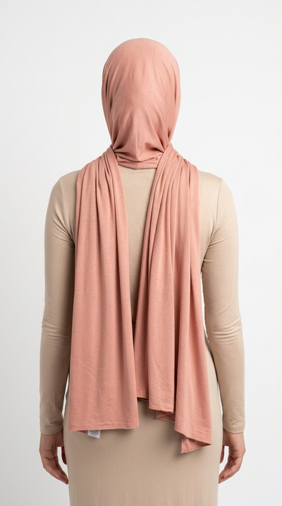 Model wearing a nude pink Premium Jersey Hijab, back view