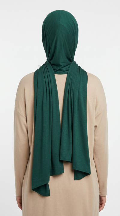 Model wearing a dark teal Premium Jersey Hijab, back view