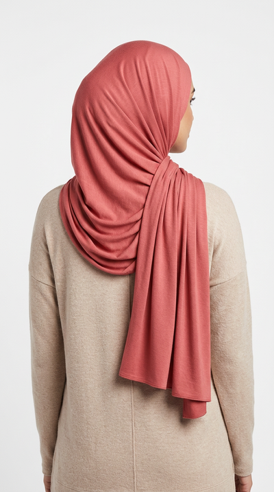 Model wearing a dusty rose Premium Jersey Hijab, back view