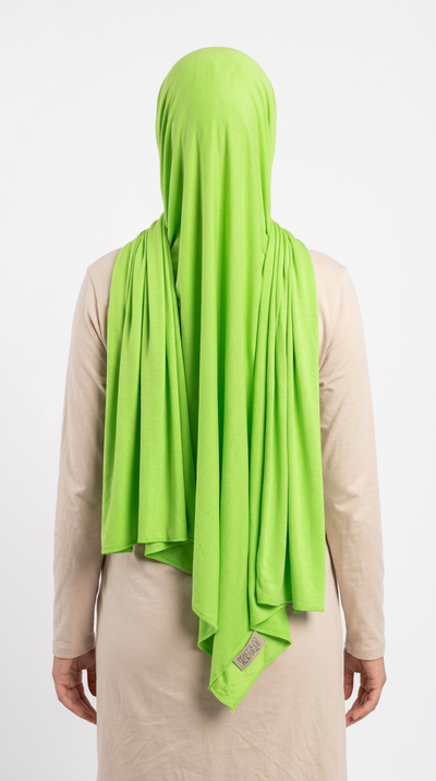Model wearing a lime green Premium Jersey Hijab, back view