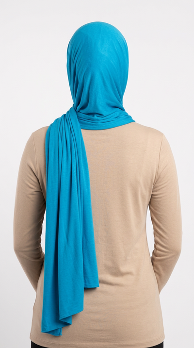Model wearing a blue Premium Jersey Hijab, back view
