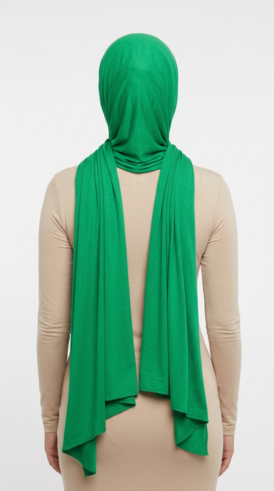 Model wearing a green Premium Jersey Hijab, back view