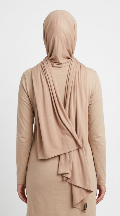 Model wearing a beige Premium Jersey Hijab, back view