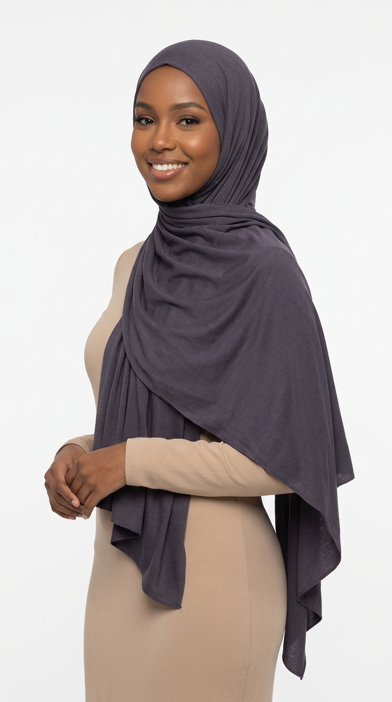 Woman wearing the Iron Big Jersey Hijab with a beige top