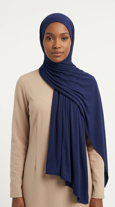 Woman wearing the Navy Big Jersey Hijab with a beige top