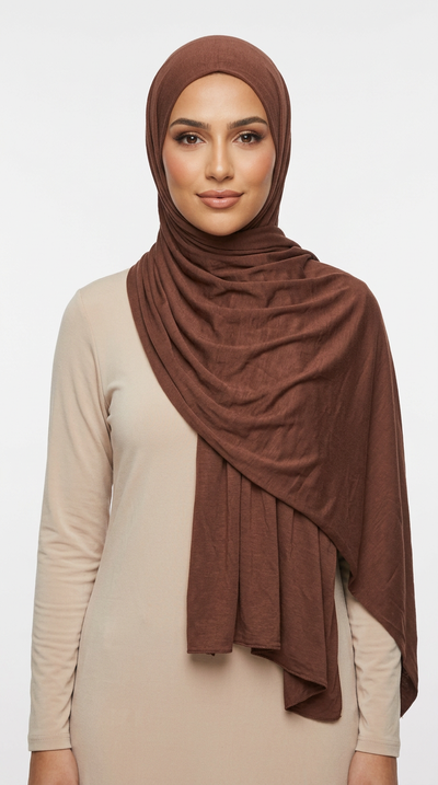 Woman wearing the Syrup Big Jersey Hijab with a beige top