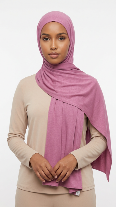 Woman wearing the Thulian Big Jersey Hijab with a beige top