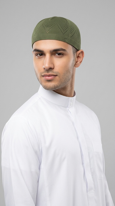 Man wearing a olive topi prayer cap, front view