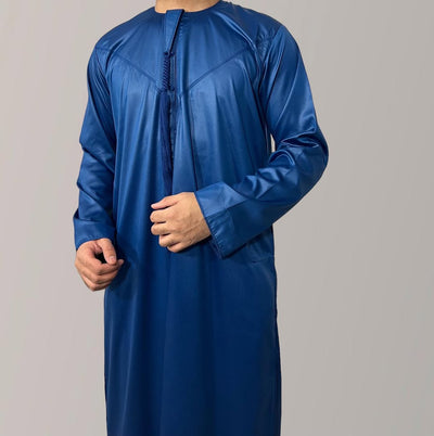 Blue long-sleeve garment on a gray background